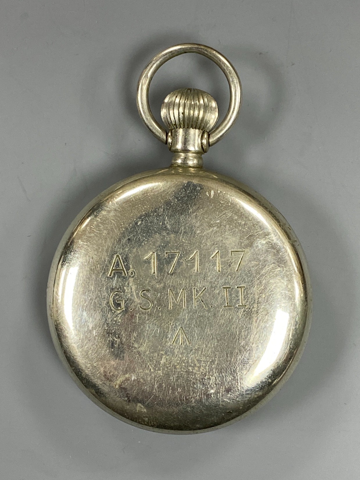 A mid 20th century nickel cased Rolex military issue open faced pocket watch, with black dial, case back with engraved broad arrow and numbered A.17117 G.S.MK.11, case diameter 50mm.